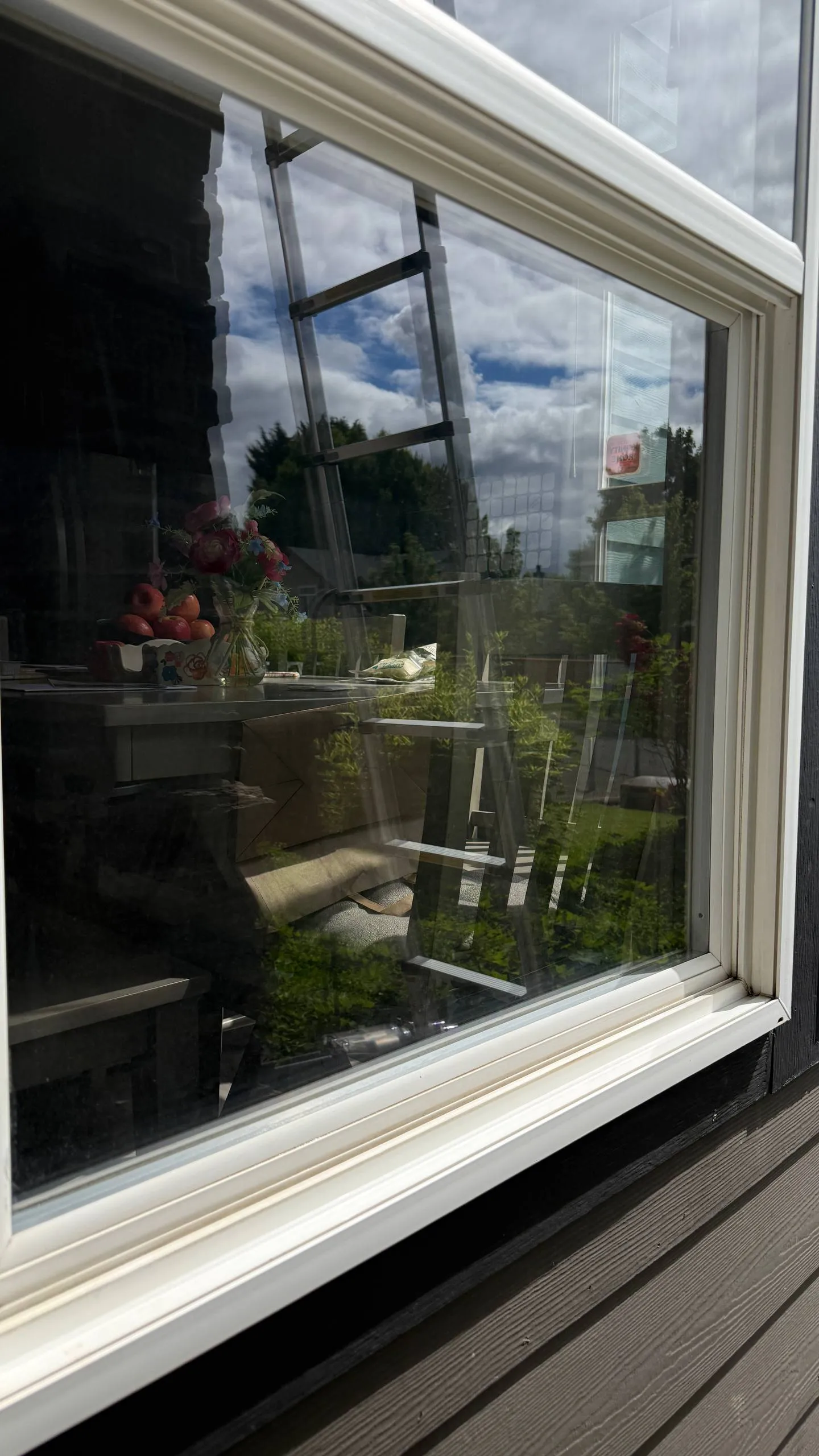 Crystal-clear window reflecting blue sky after professional cleaning